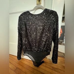 Black, sequin bodysuit with shoulder pads by A Calin by Flying Tomato.